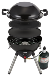 Black Coleman 4-1 Portable Propane Cooking System. Features three interchangeable cook top inserts (stove, wok and reversible griddle/grill). Removable legs and cook top inserts fit inside inverted wok for easy storage.